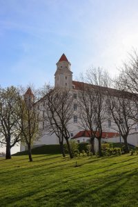 a large white building with a clock tower